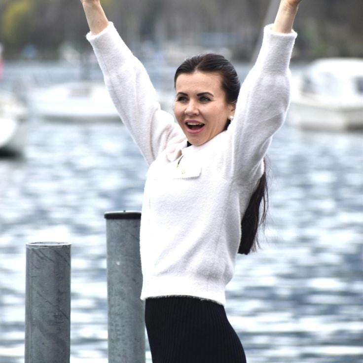 Kaveri Mehta, Lead Design Curator at River Meander Marble, reviewing corporate floral arrangements